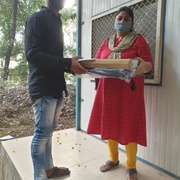 Laptops being given to Prayas clients children who need help for online classes