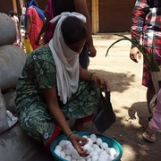 Woman client selling eggs with support from Prayas