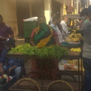 Woman client selling vegetables with Prayas support