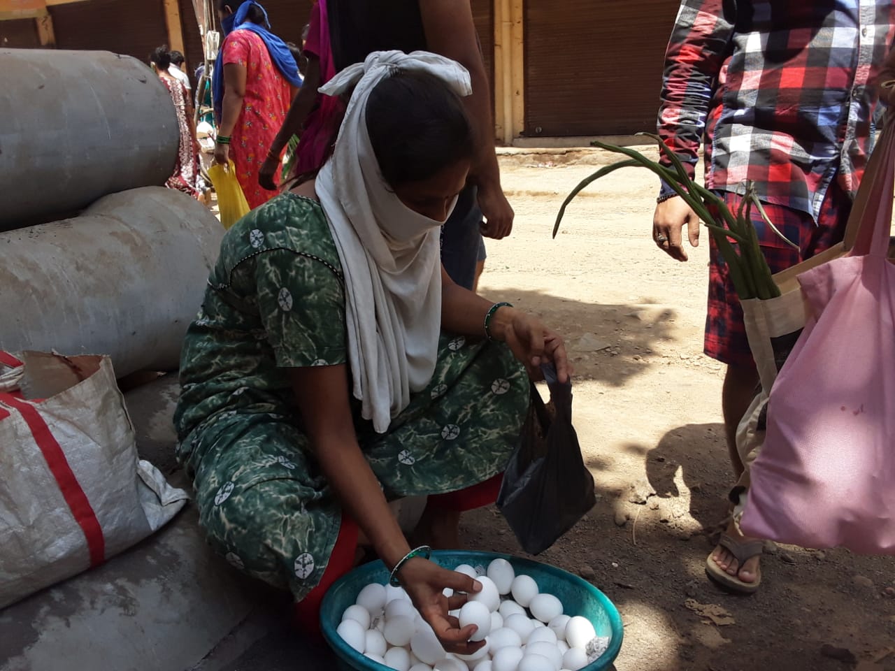 Woman client selling eggs with support from Prayas