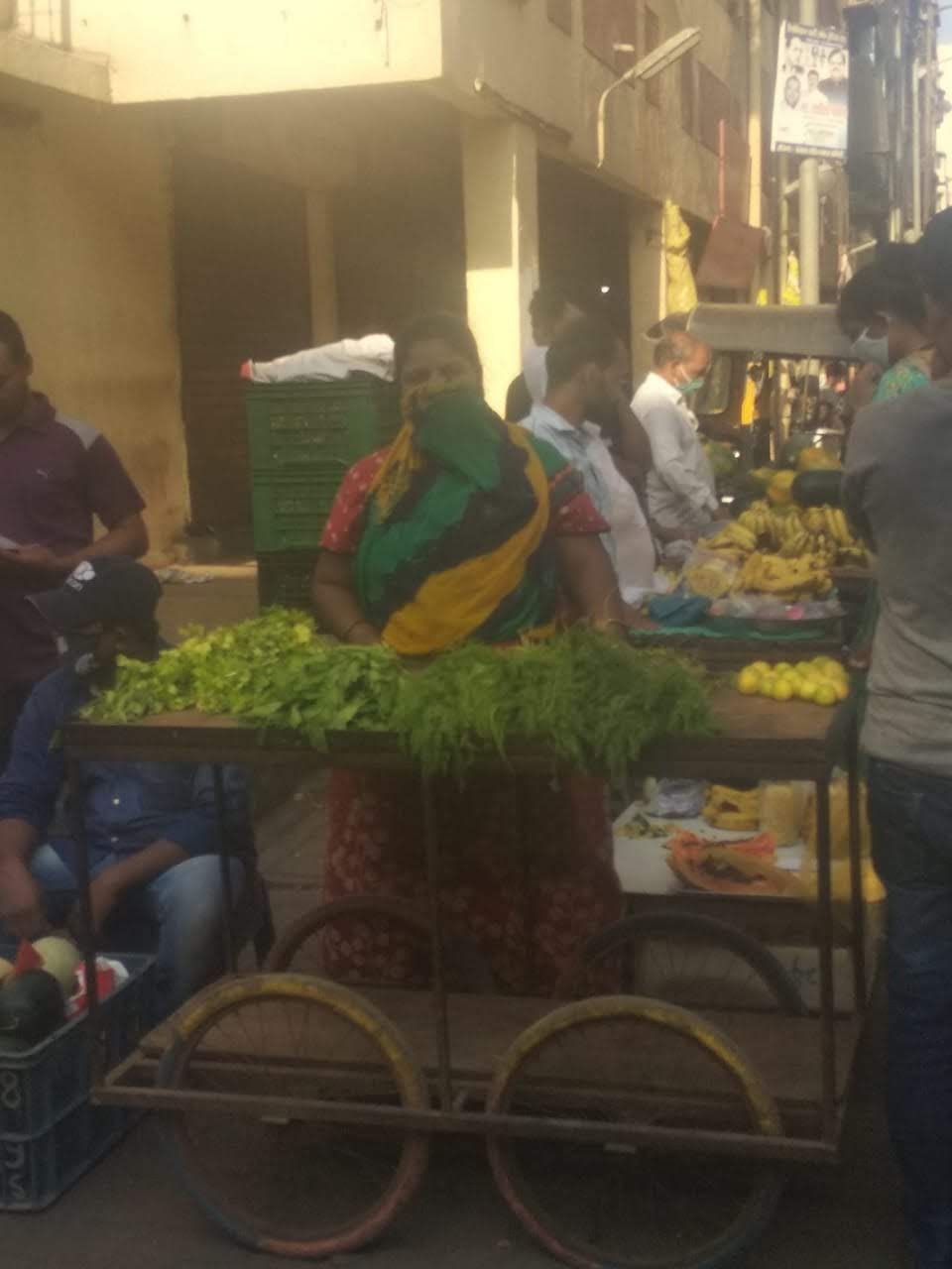 Woman client selling vegetables with Prayas support