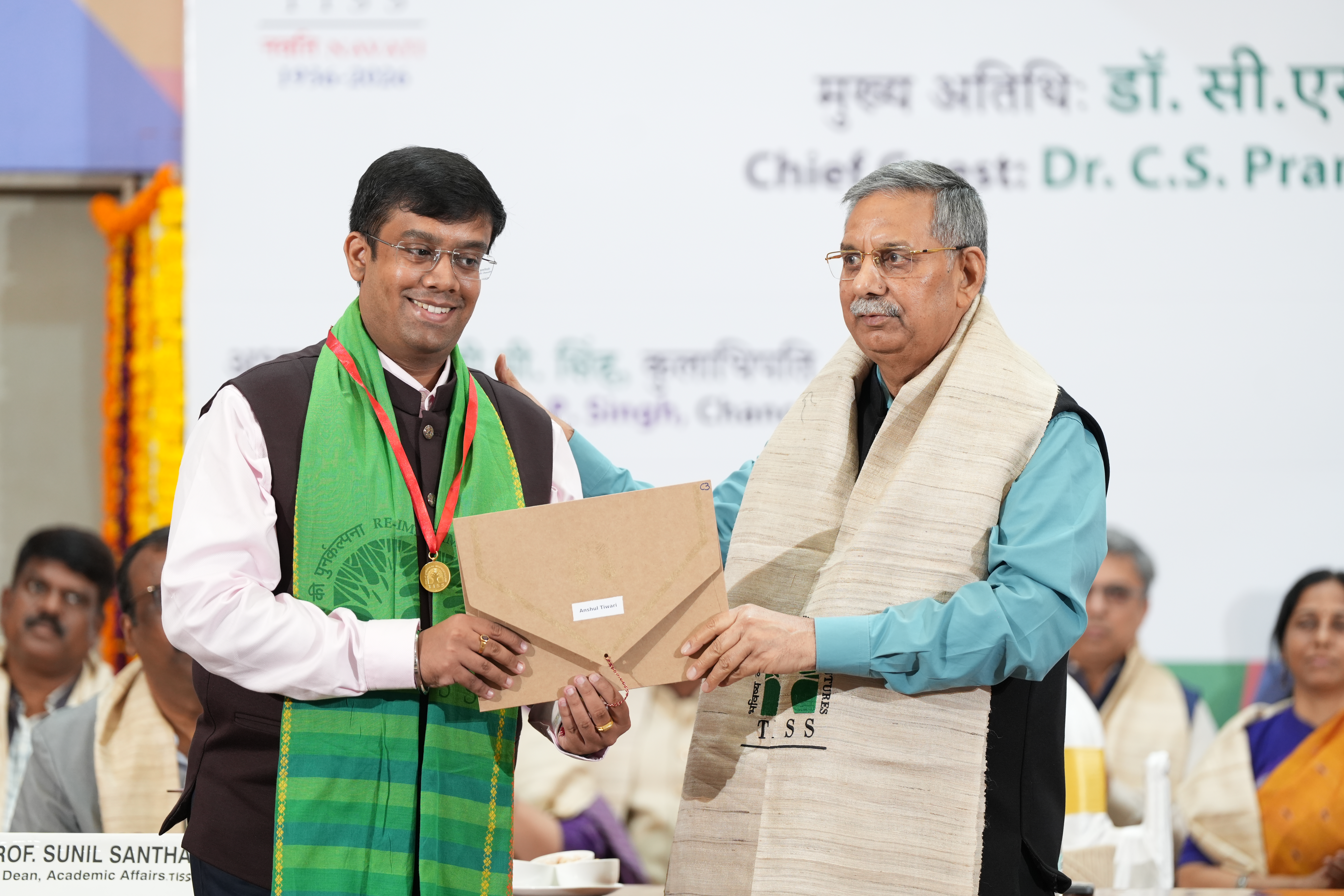 Gold medals with red ribbons for the Chancellor's Gold Medal award